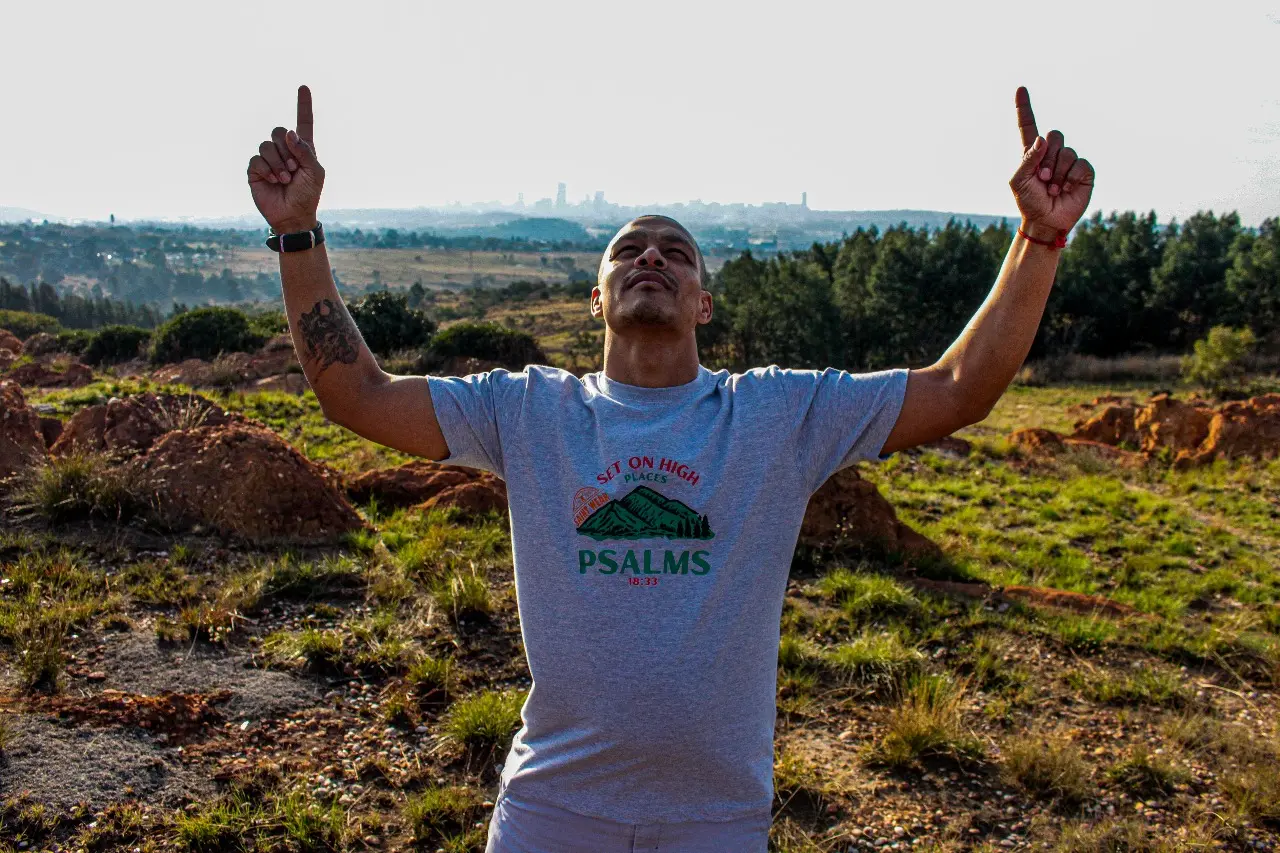 Model wearing urban streetwear against city backdrop